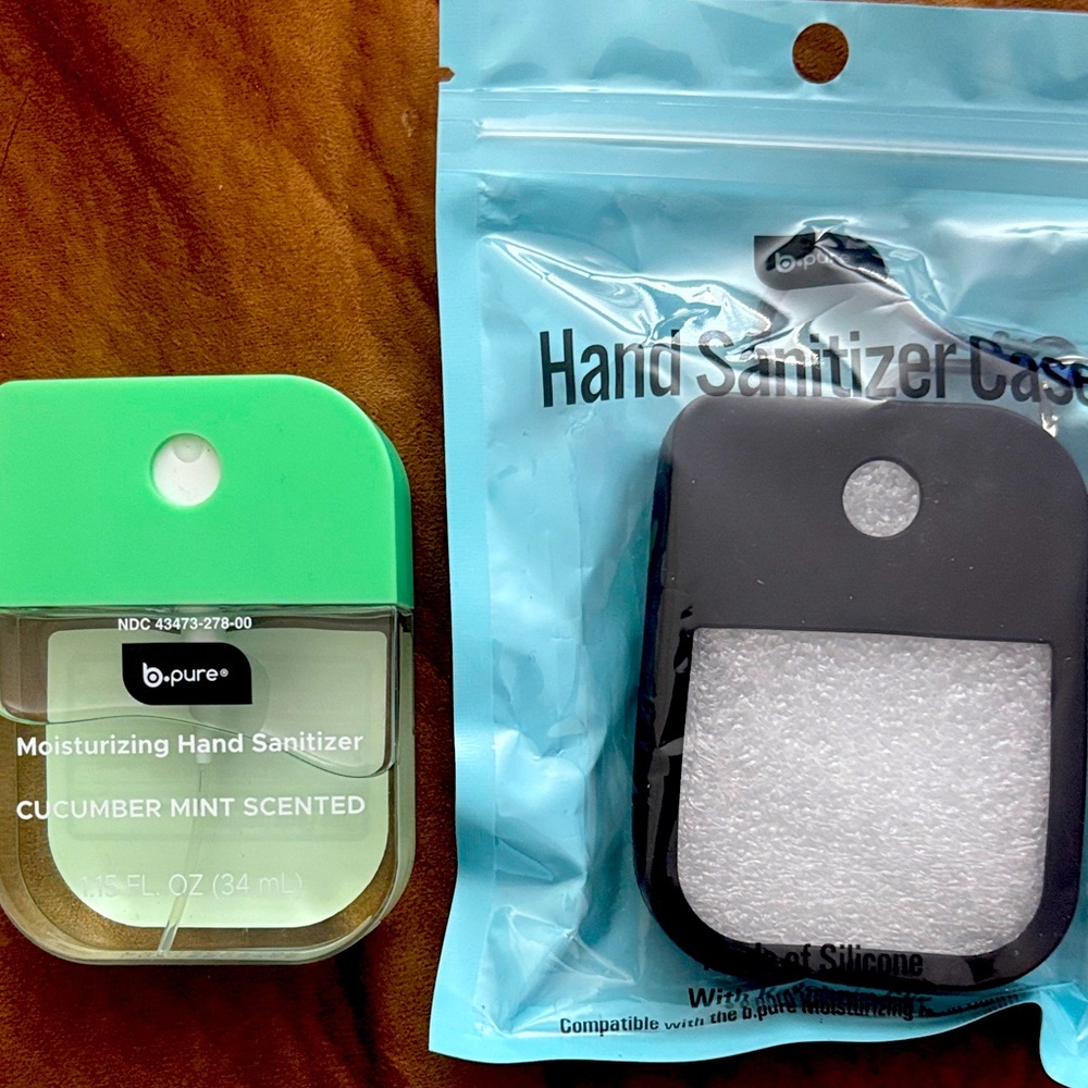 Bpure hand sanitizer and carry case in black. Scent cucumber mint